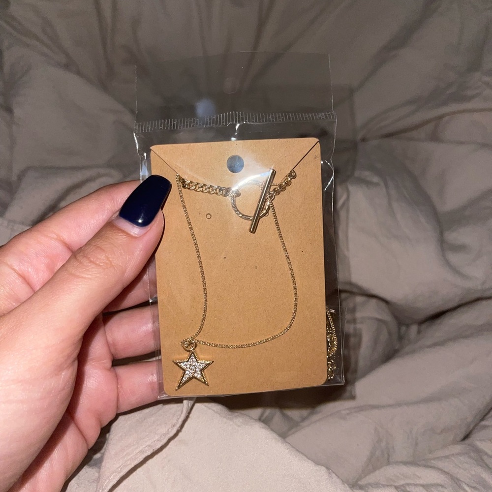 long gold star necklace brand new